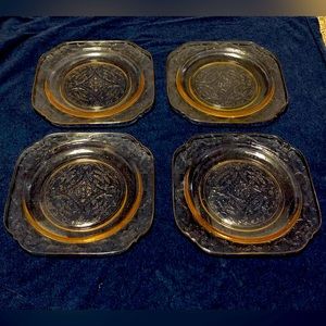 Vintage set of four pink depression plates